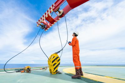 Mechanical crane inspector inspect crane system as annual preventive maintenance schedule, He’s test and check hook, cable, sleeve and hydraulic system. Offshore operation.