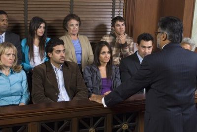 Rear view of a advocate communicating with the jurors