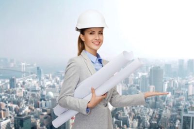 woman holding blueprints